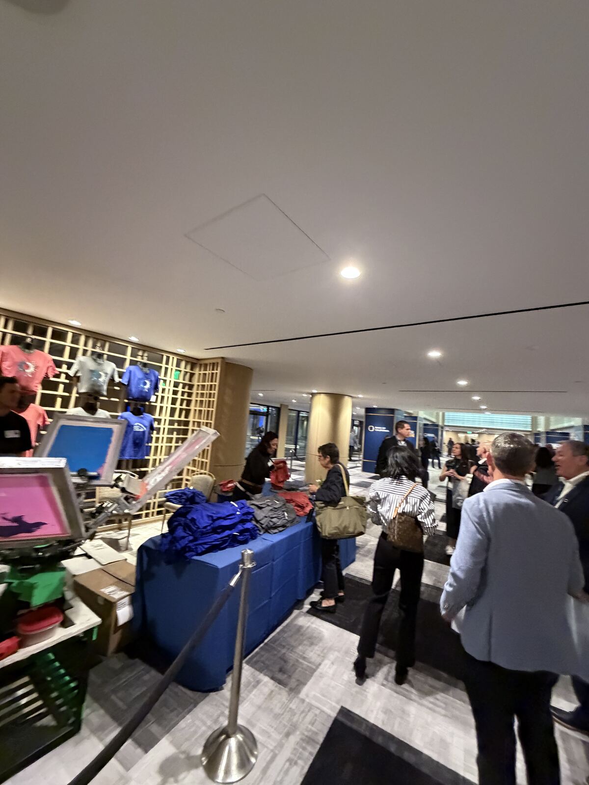 Attendees gathered at an event booth